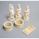 A Chinese ivory figure of Guanyin, a pair of ivory chess pieces, two Cantonese napkin rings and a