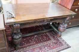 A 17th century style rectangular oak draw leaf dining table on carved baluster legs, 275cm extended,