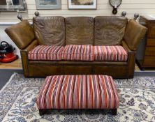 A studded tan leather Knowle settee with striped fabric loose cushion seat, length 220cm, depth