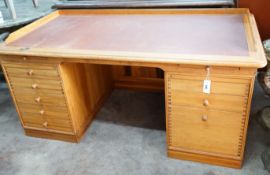 A Finn Hansen Danish pine kneehole pedestal desk with opposing drawers and cupboards, length