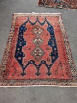 A Caucasian style blue ground geometric rug, 215 x 155cm