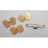 A pair of 9ct gold cufflinks, one other single 9ct gold cufflink and a 9ct and gem set bar brooch,