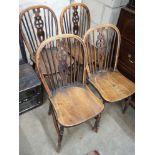 A set of four Victorian ash and elm Windsor wheelback dining chairs