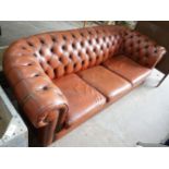 A modern Victorian style buttoned brown leather Chesterfield settee, length 200cm, depth 82cm,