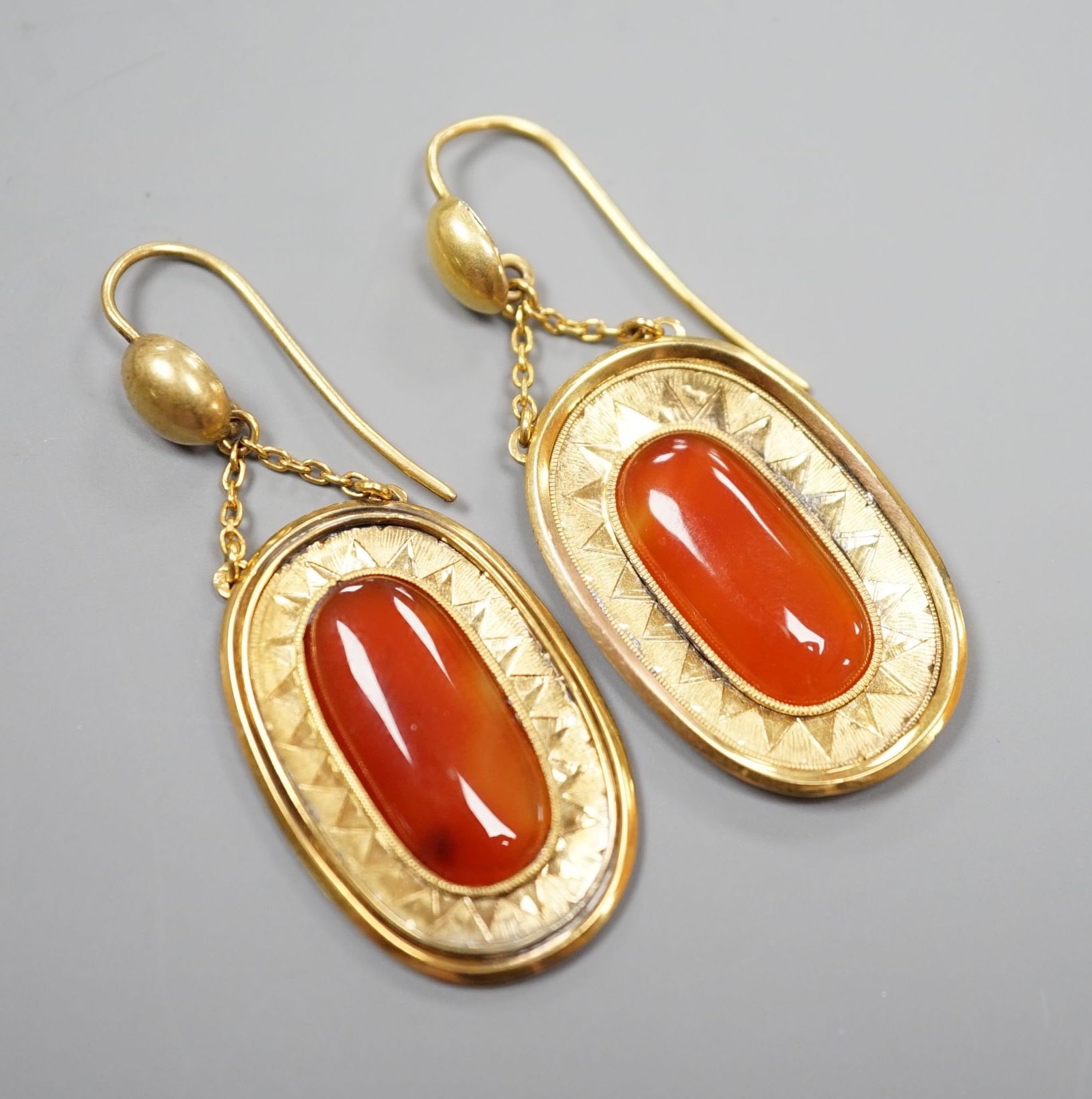 A pair of yellow metal and orange agate set oval drop earrings, overall 46mm, gross 6.8 grams. - Image 2 of 4