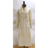 An Edwardian white/cream linen lady's coat with cut work detail and unusual button detail to the