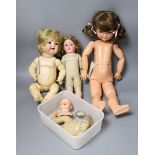 A kid leather bodied jointed limb open mouth Heubach bisque headed doll together with two other