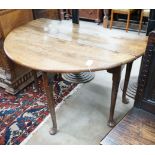 A George III provincial oak drop leaf pad foot dining table, length 120cm extended, width 120cm,