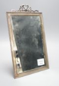 A George V silver mounted rectangular easel mirror, with ribbon bow crest, Stokes & Ireland Ltd,