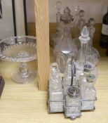 Sundry glassware including a six bottle cruet set on a plated stand, a Victorian cut glass jug, a