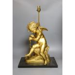 A gilt bronze seated Cupid figural lamp on mount - 58cm tall