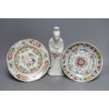 A Chinese blanc de chine figure of Guanyin, probably 18th century and two famille rose plates.