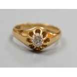 An Edwardian 18ct gold and claw set solitaire diamond ring, size N, gross weight 4.8 grams.
