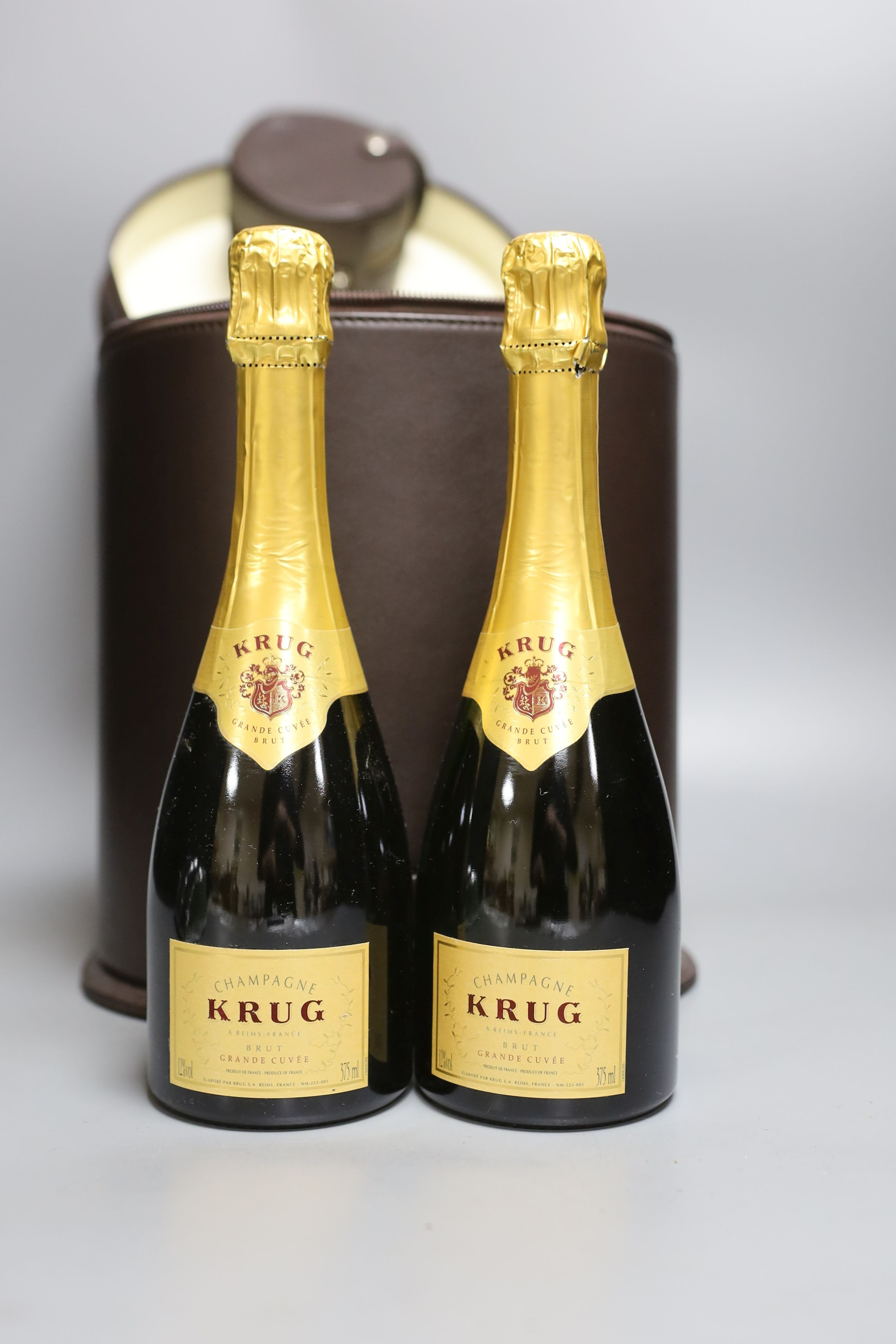 A Connolly leather Krug champagne carrier with dust cover, containing: two half bottles, two - Bild 2 aus 2