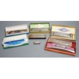 Eight various harmonicas, some with boxes