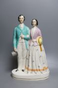 A Staffordshire portrait group of a couple possibly Victoria and Albert. 37cm