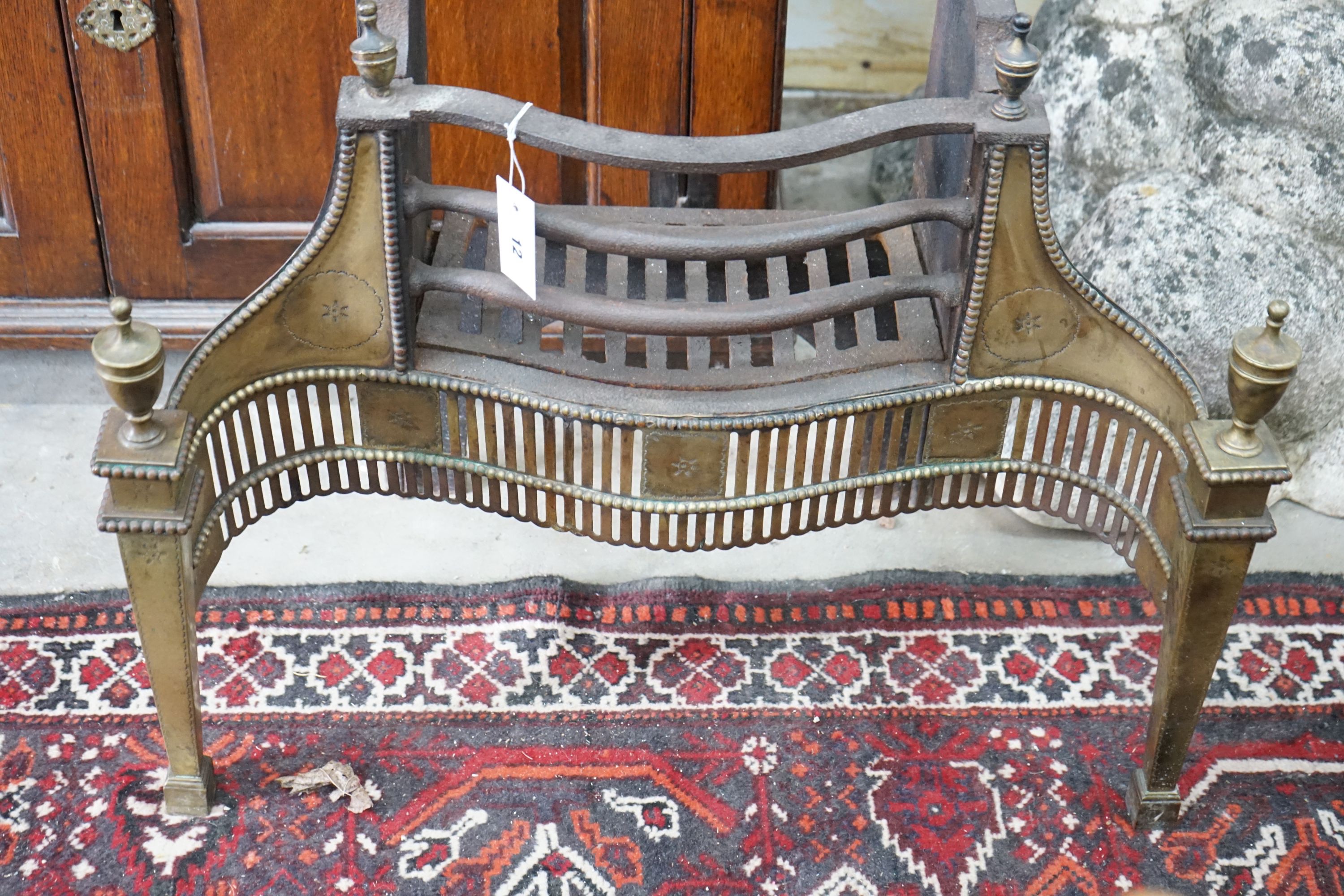 A Thomas Elsley Georgian style serpentine brass mounted cast iron fire grate, lacking back plate, - Image 3 of 3