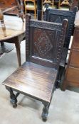 A pair of late Victorian 17th century style carved oak side chairs