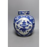 A Chinese Kangxi blue and white jar and cover 23cm