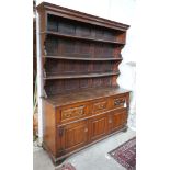 An 18th century oak dresser with boarded rack, width 150cm, depth 47cm, height 196cm