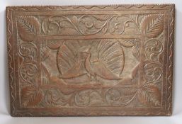 An Indian carved hardwood panel,51.5 cms high x 35 cms.