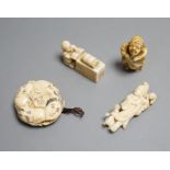 A Japanese ivory netsuke of a man reading a book, a small okimono of Guanyin and monkeys, a Manju