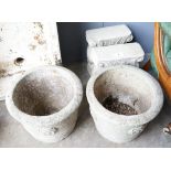 A pair of circular reconstituted stone garden planters, diameter 42cm together with a pair of