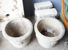 A pair of circular reconstituted stone garden planters, diameter 42cm together with a pair of