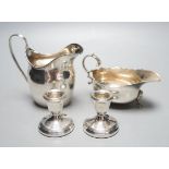 A George III silver jug, London, 1798, a silver sauce boat and pair of silver mounted dwarf