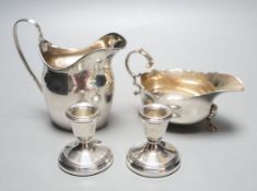 A George III silver jug, London, 1798, a silver sauce boat and pair of silver mounted dwarf