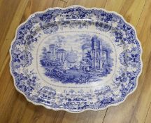 A large Victorian blue-printed stone china meat plate depicting 'Venetian scenery' - 54cm long