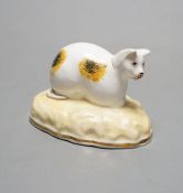 A rare Samuel Alcock porcelain model of a recumbent cat, circa 1835-50, impressed ‘6’, Cf. Dennis G.