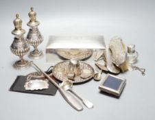 Assorted small silver including a cigarette box, pair of German 800 pepperettes, wine labels,