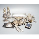 Assorted small silver including a cigarette box, pair of German 800 pepperettes, wine labels,