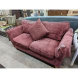 A contemporary plum fabric two seater settee, length 176cm, depth 84cm, height 86cm