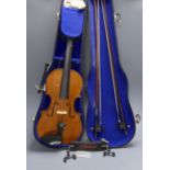 A 20th century violin in case with two bows, length of back 35.5cm