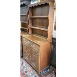 An early 20th century Flemish carved oak dresser, width 91cm, depth 40cm, height 177cm