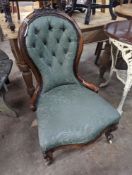 A Victorian walnut spoon back nursing chair