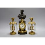 A bronze and ormolu bust mounted pedestal timepiece and a pair of gilt metal lustres 27cm