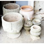 A pair of circular reconstituted stone garden urns, diameter 36cm, a terracotta strawberry pot and