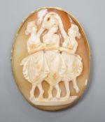 A yellow metal mounted oval cameo shell pendant brooch, carved with The Three Graces, 62mm, gross