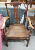 A large George III oak wood seat elbow chair, width 68cm, depth 47cm, height 112cm