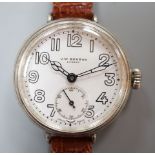 A gentleman's 1920's silver J.W. Benson manual wind wrist watch, with Cyma movement and white