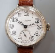 A gentleman's 1920's silver J.W. Benson manual wind wrist watch, with Cyma movement and white