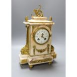 An early 20th century French gilt metal mounted marble clock with pendulum and key 35cm