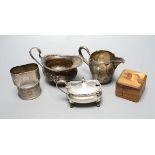 A late Victorian silver cream jug, London, 1900, a German 800 cream jug, a silver mustard pot, two