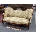 A Victorian upholstered carved rosewood double spoonback settee, width 176cm, depth 74cm, height