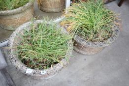 A pair of matching reconstituted stone circular garden planters, diameter 51cm, height 26cm