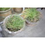 A pair of matching reconstituted stone circular garden planters, diameter 51cm, height 26cm