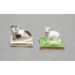 A rare Chamberlain Worcester model of a recumbent kitten, c.1820–40 and a Staffordshire porcelain